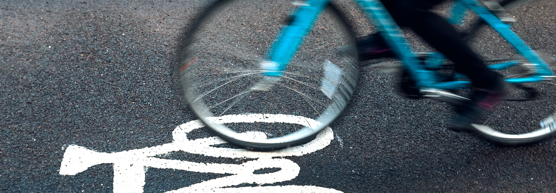 Photo of a bicycle in motion on a crosswalk