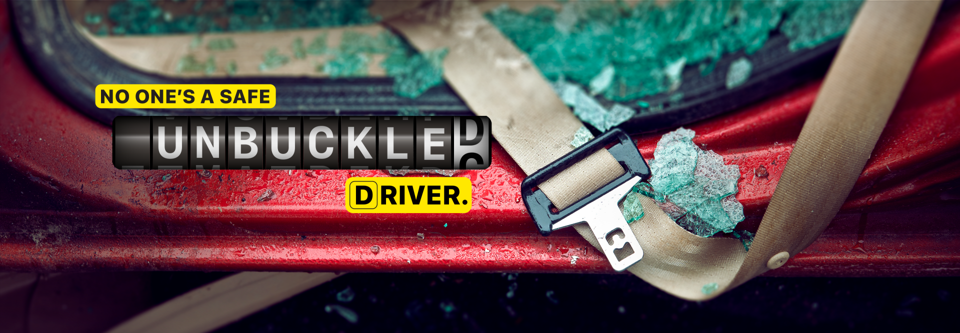 Photo of two crashed vehicles with police vehicles and flashing lights in the background