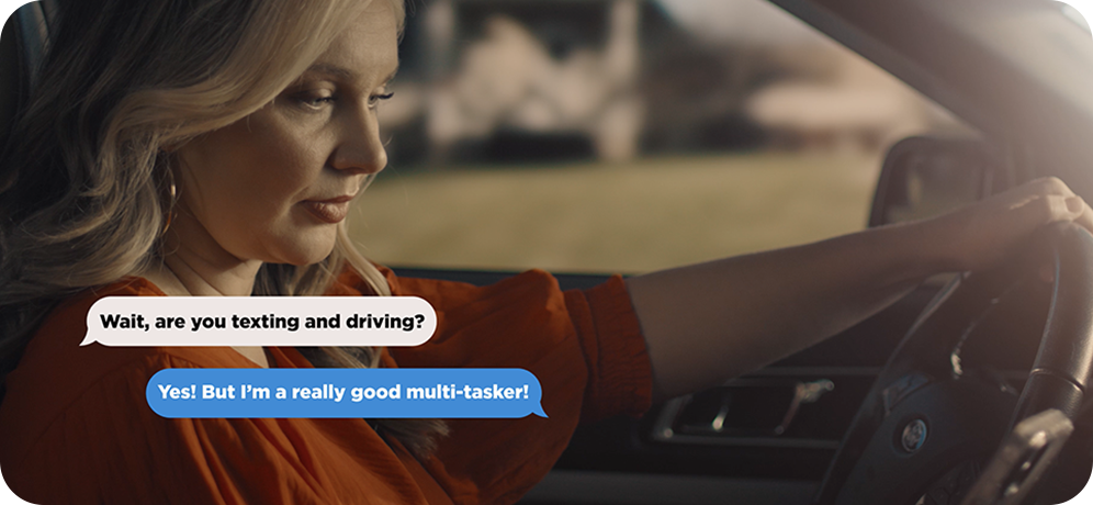 Photo of woman texting and driving