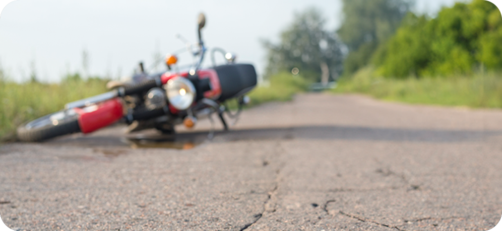 Photo of motorcycle on its side